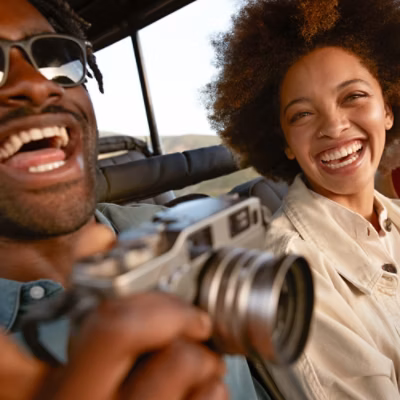 Two people smiling at a camera.