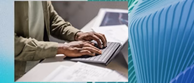 A person typing on a keyboard.