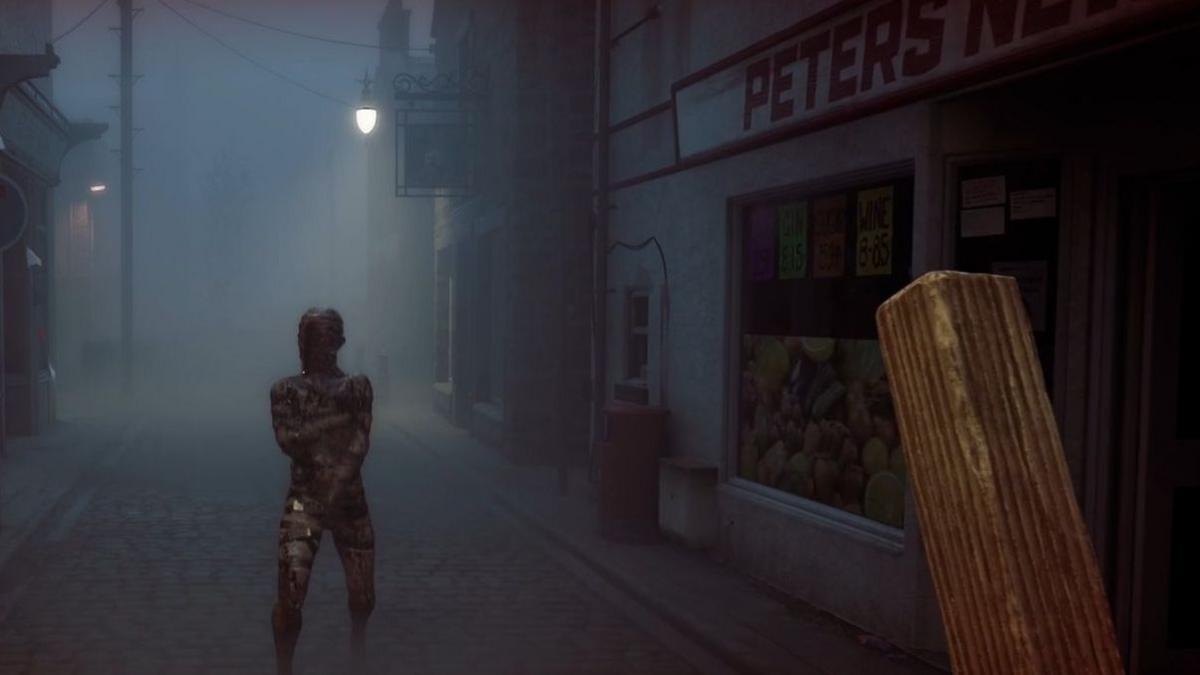 An in-game screenshot showing a faceless monster in a first-person view, with the player holding a plank of wood. They are in the middle of a foggy street with a newsagents on the side.