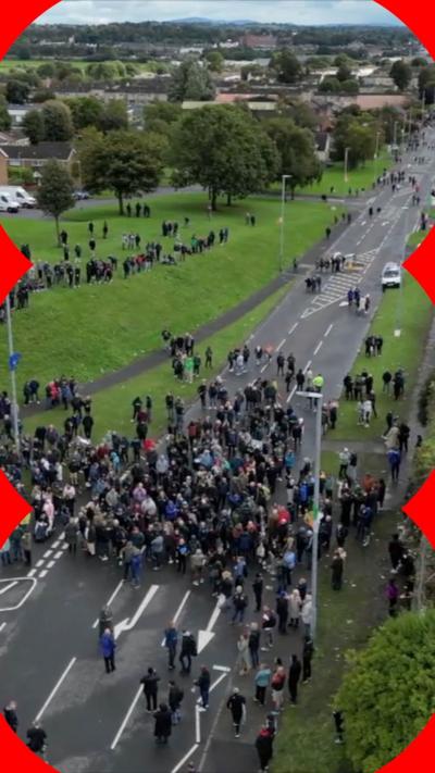 Crowds of people block the Garvaghy Road in Northern Ireland.