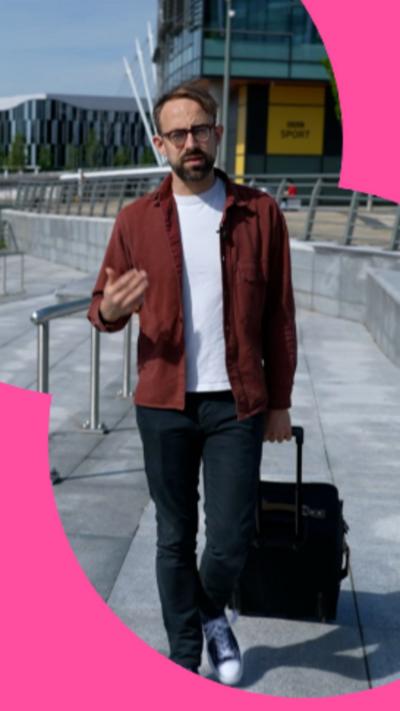 A man walking with a suitcase