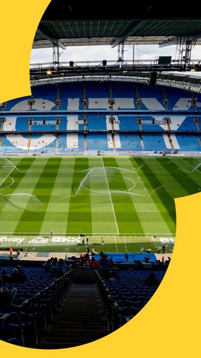 A picture inside Manchester City football stadium. The stands are empty and so is the pitch. The word "City" is visible, spelt out in giant letters formed of white seats in the background.