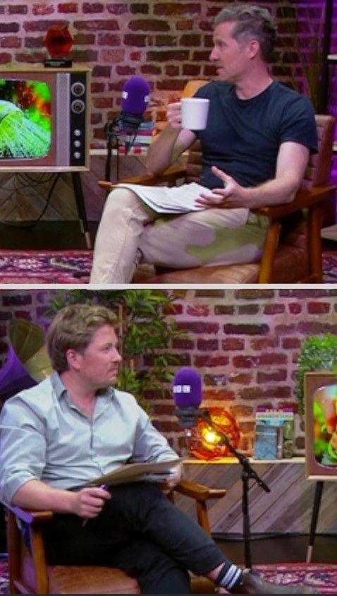 Two men sitting in a podcast studio.