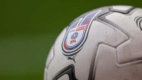 A close-up of a football with EFL branding