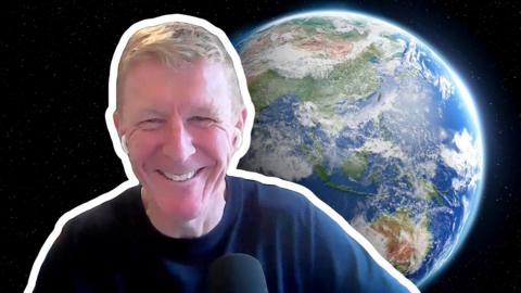 Tim Peake smiles to camera. He is cut out of a picture with a white outline, Earth in space is visible in the background.