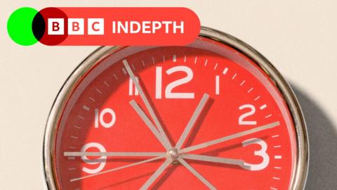A red clock showing grey whirring hands, on the upper left there is a red logo which reads BBC InDepth in white lettering