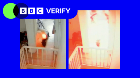 A split image imposed over the BBC Verify colours and branding shows an e-scooter on fire in a hallway in a home. Flames are emerging from the rear of the scooter in the first image, before engulfing the entire frame in the second. 