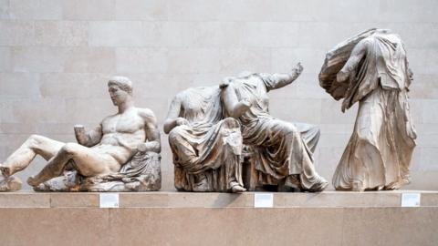 Some of the Parthenon sculptures in the British Museum. The sculptures are damaged, with some missing limbs and heads