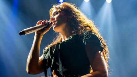 Kate Nash performing on stage 