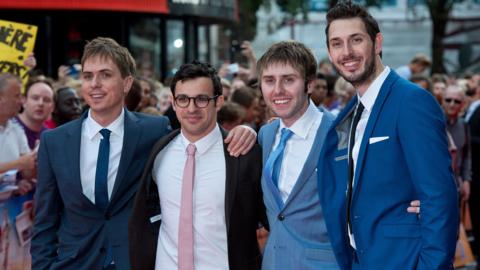 Simon Bird, Joe Thomas, James Buckley and Blake Harrison pose for photos at the world premiere of The Inbetweeners 2. The group are all wearing suits with skinny ties. 