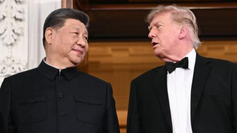 China's President Xi Jinping and US President Donald Trump pose on the North Portico steps of the White House ahead of a State Dinner in Washington, DC, on September 24, 2026.
