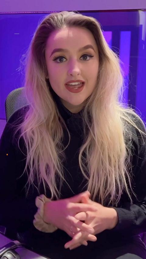Presenter Ellie Colton looking at the camera 