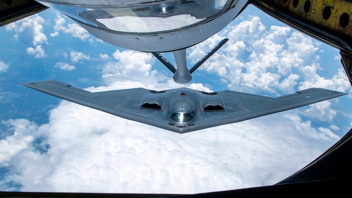 A KC-135 Stratotanker from the 121st Air Refueling Wing refuels a Northrop Grumman B-2 Spirit over the skies of Missouri, June 7, 2023