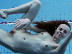 Super slender girl showing off her beauty underwater